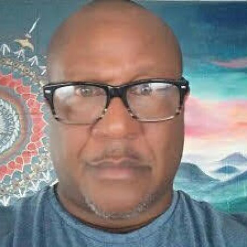 "With over three decades of experience in holistic wellness, nonprofit leadership, and hospitality consulting, Phillip is dedicated to fostering well-being through mindful movement and sustainable living. As the founder and director of Rising Lotus, Inc., in Owensboro, KY, Phillip built a nonprofit yoga teacher-training school, studio, and community garden, incorporating his ""seed to health"" curriculum. Phillip’s work includes authoring The Rising Lotus Yoga Teacher Training Manual, securing a $70,000 grant for the H.L. Neblett Center’s Deep Roots Garden, and organizing transformative events like yoga festivals and Vetoga (veteran-focused yoga). Phillip has been an independent yoga instructor, fasting detox counselor, personal trainer, massage therapist, and addiction counselor in CA, HI, KY, and IN since 1998. Phillip’s training includes a six-month live-in Iyengar teacher training at the Heartwood Institute, a 200-hour yoga teacher training program at Frog Lotus in Western Massachusetts, 1,200 hours of therapeutic massage training, and a WATSU certification. Phillip is an ACE-certified personal and group trainer. Phillip spent two months in Goa, India, studying WATSU and Ashtanga Yoga independently. My studio yoga teaching style is methodical, based on the integration of the principles and values of Patanjali’s eight-limb path. I emphasize the importance of moving in stillness, with focus and breath. Join Phillip in cultivating wellness—on the mat, in the garden, and across the globe. Phillip U Bibb